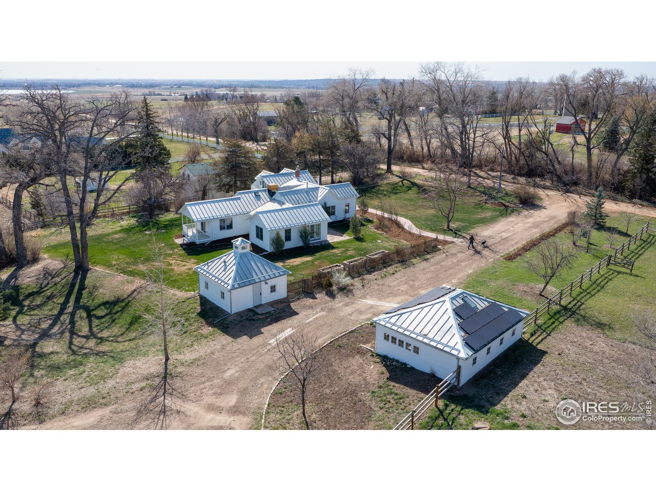 5629 Prospect Road Niwot, CO 80503 - Photo 2 of 40 a backyard of a house with table and chairs