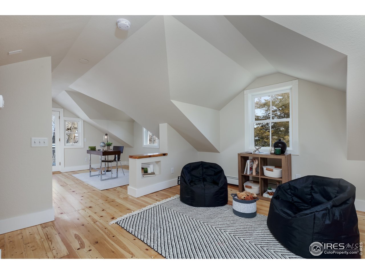 5629 Prospect Road Niwot, CO 80503 - Photo 22 of 40 a living room with furniture and a window