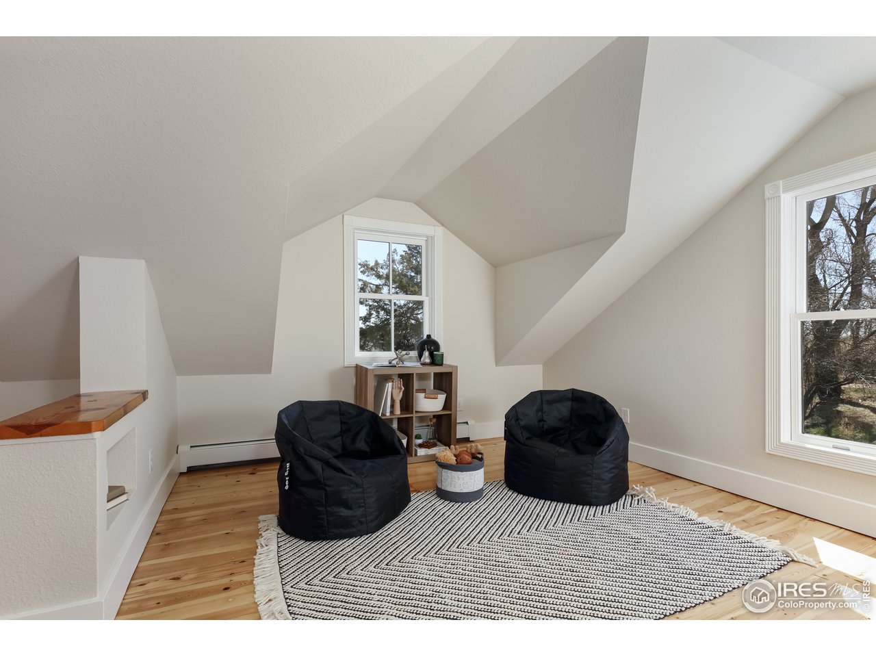 5629 Prospect Road Niwot, CO 80503 - Photo 23 of 40 a living room with furniture and a window