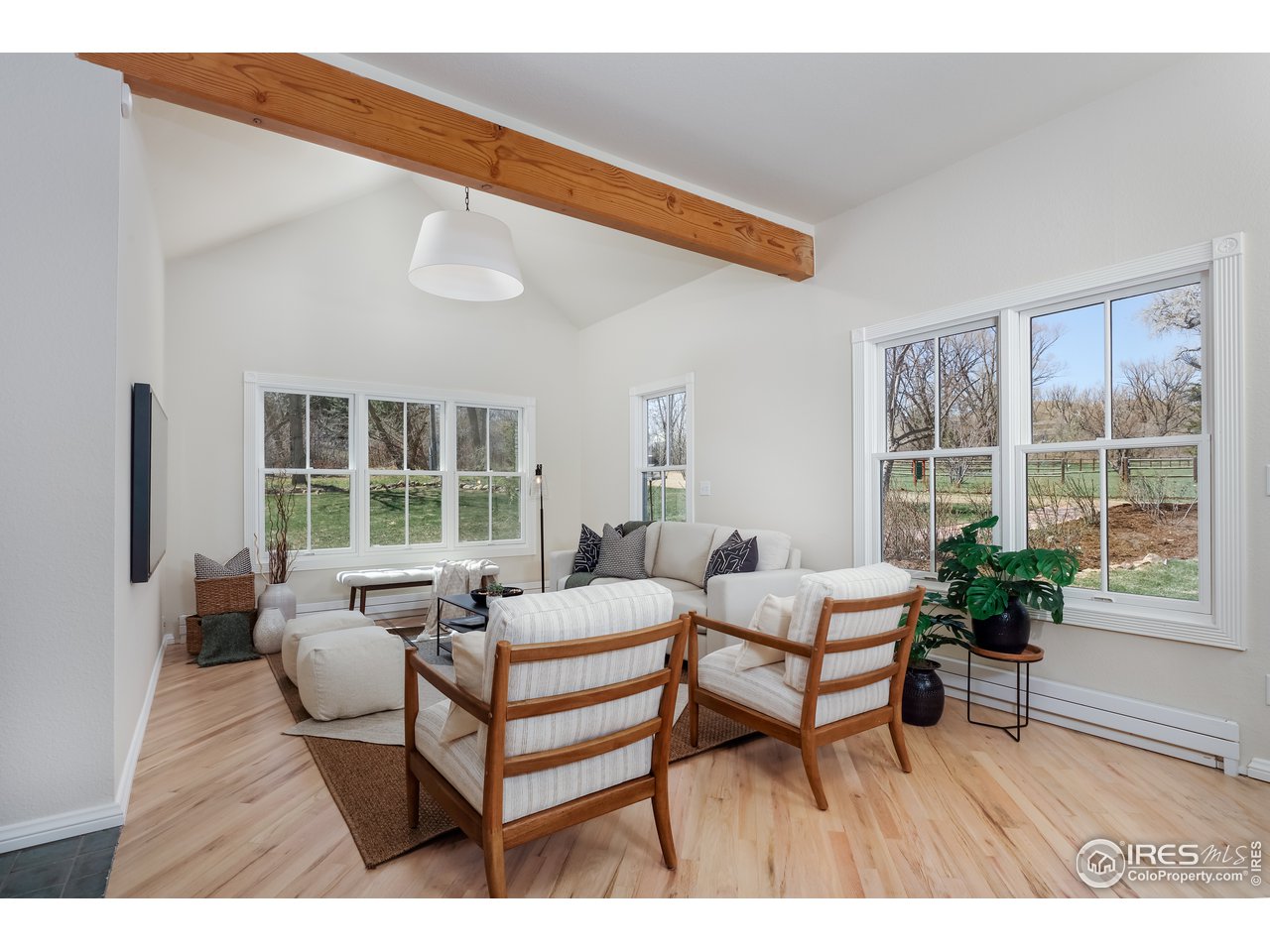 5629 Prospect Road Niwot, CO 80503 - Photo 3 of 40 a living room with furniture and a large window
