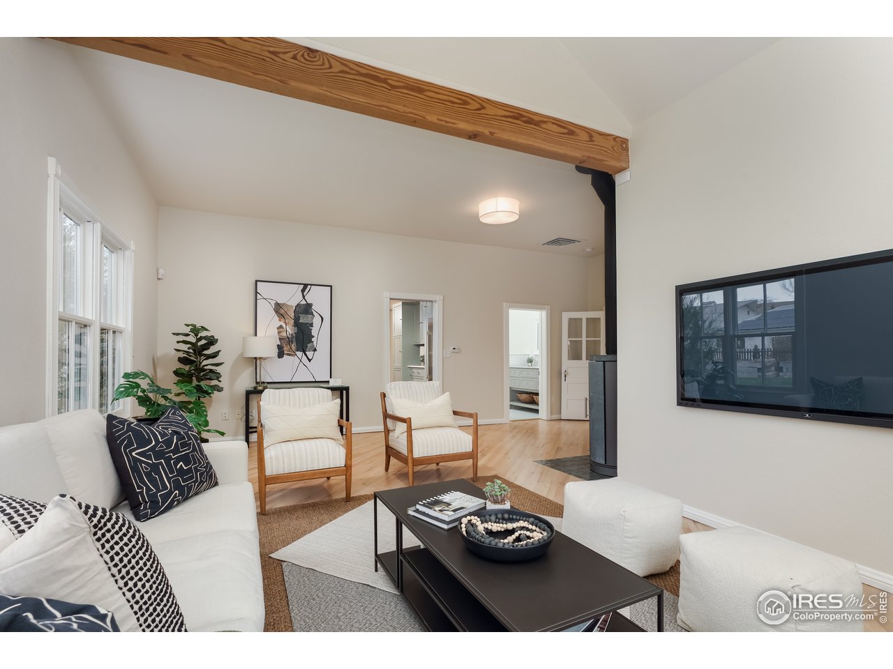 5629 Prospect Road Niwot, CO 80503 - Photo 4 of 40 a living room with furniture and a wooden floor