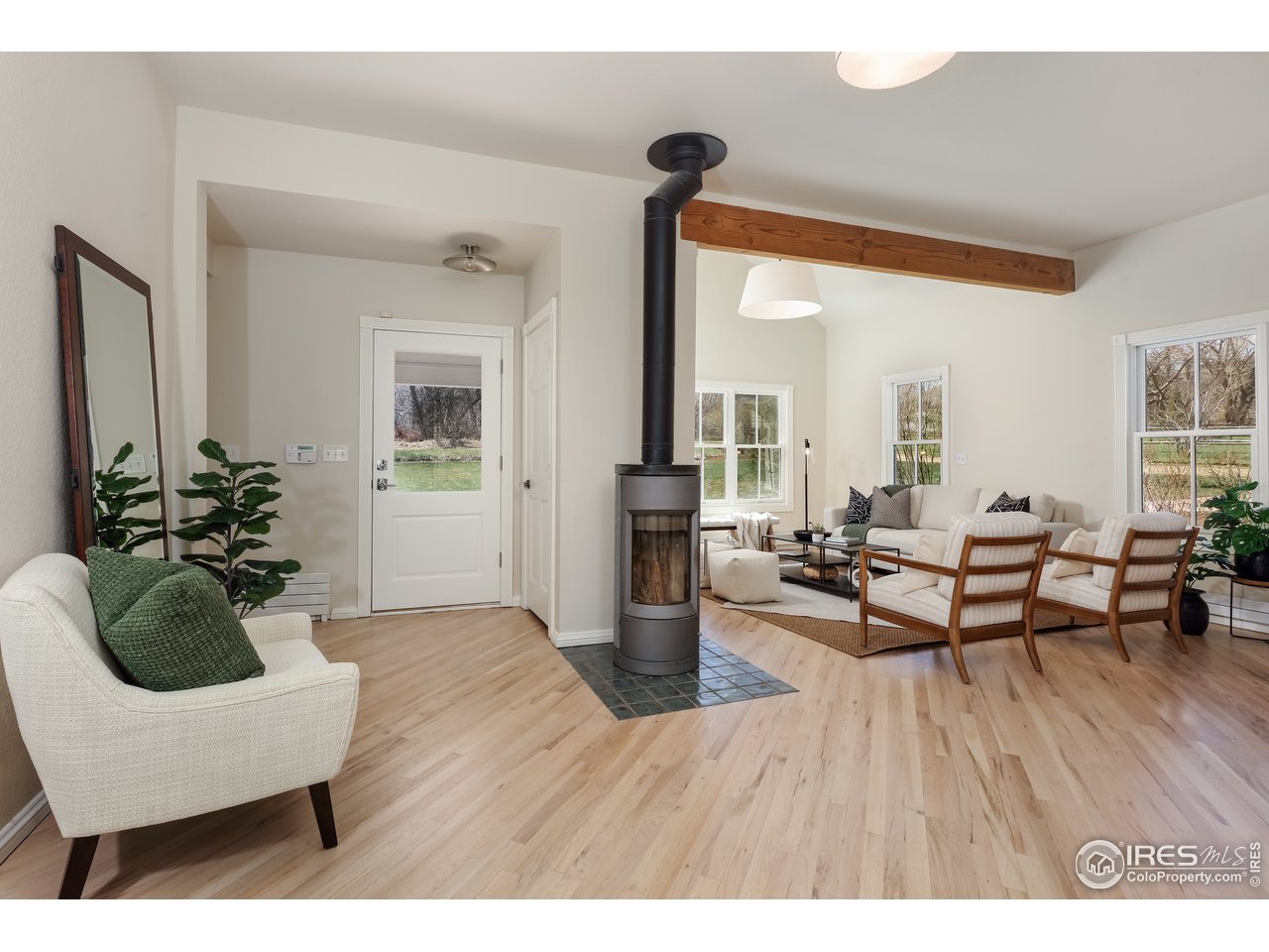 5629 Prospect Road Niwot, CO 80503 - Photo 5 of 40 a living room with furniture and a wooden floor