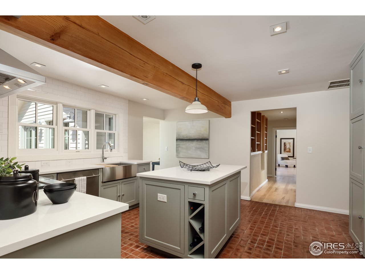 5629 Prospect Road Niwot, CO 80503 - Photo 6 of 40 a kitchen with a sink a stove and chairs