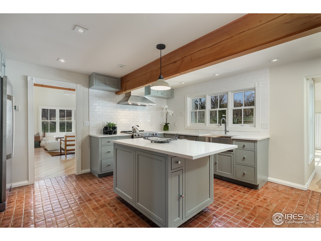 5629 Prospect Road Niwot, CO 80503 - Photo 8 of 40 a kitchen with a stove a sink and a refrigerator
