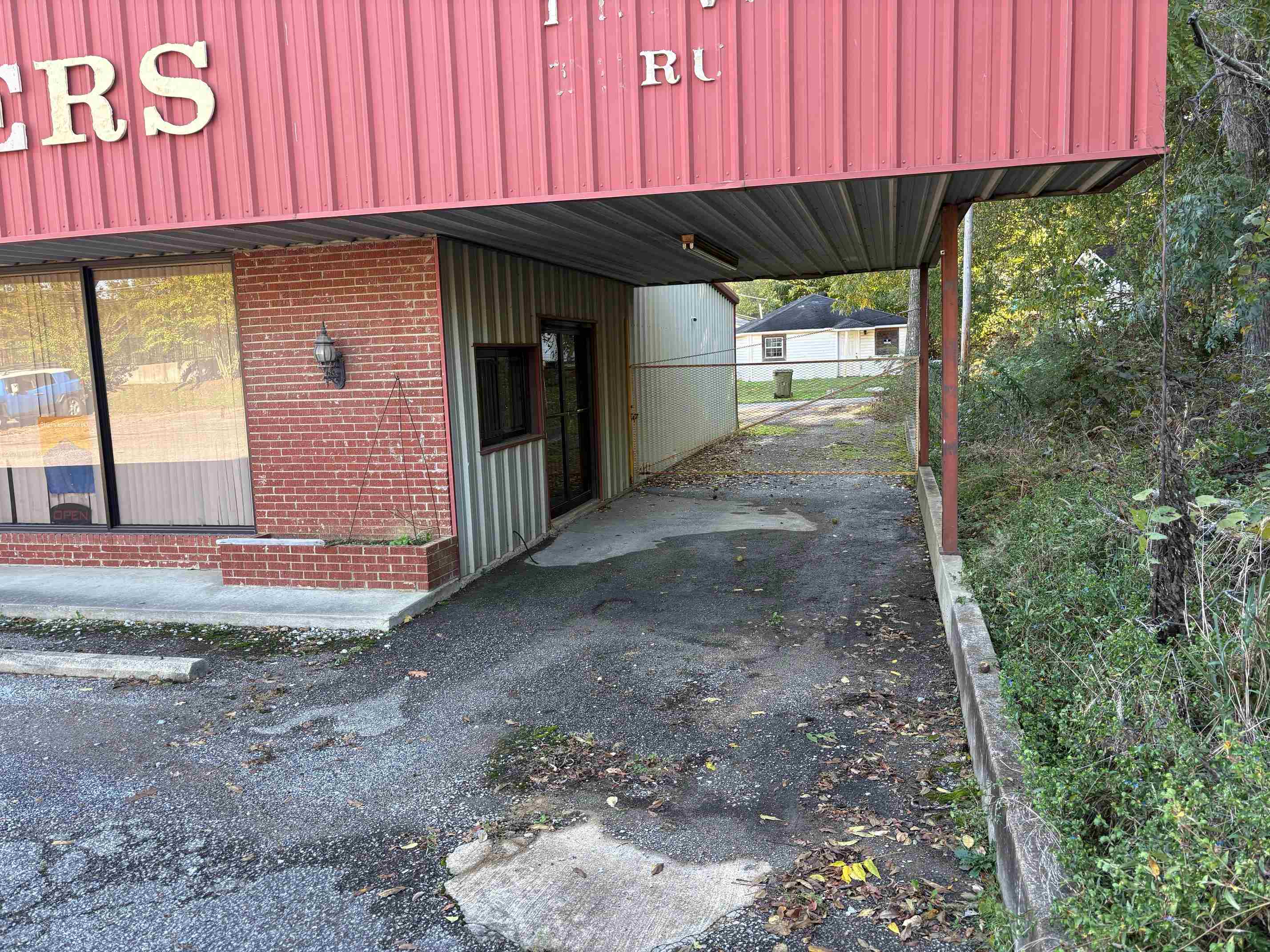 334 Washington Street Ripley, TN 38063 - Photo 4 of 12 a front view of a house with a garden