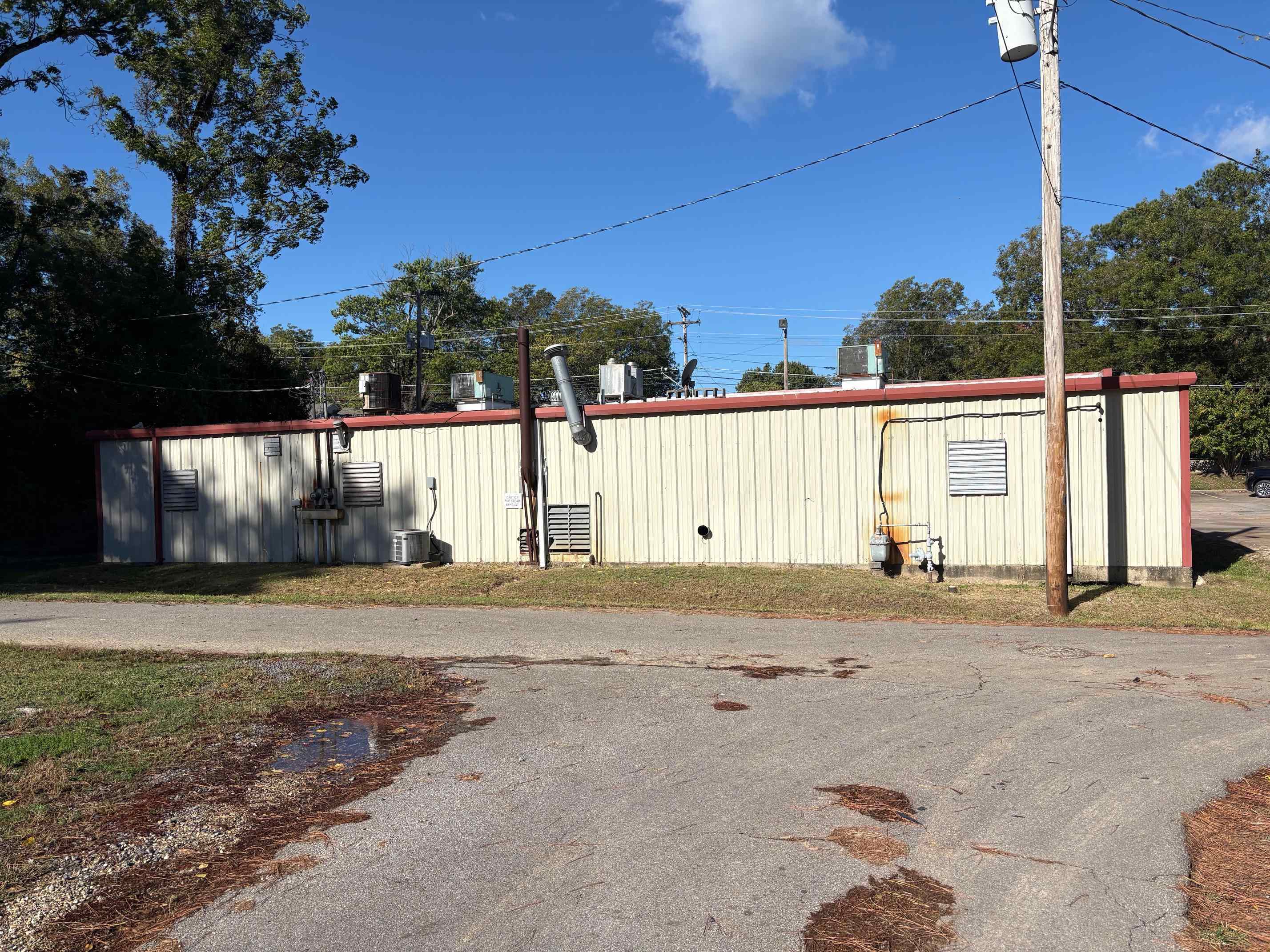 334 Washington Street Ripley, TN 38063 - Photo 6 of 12 a view of a house with a yard and garage