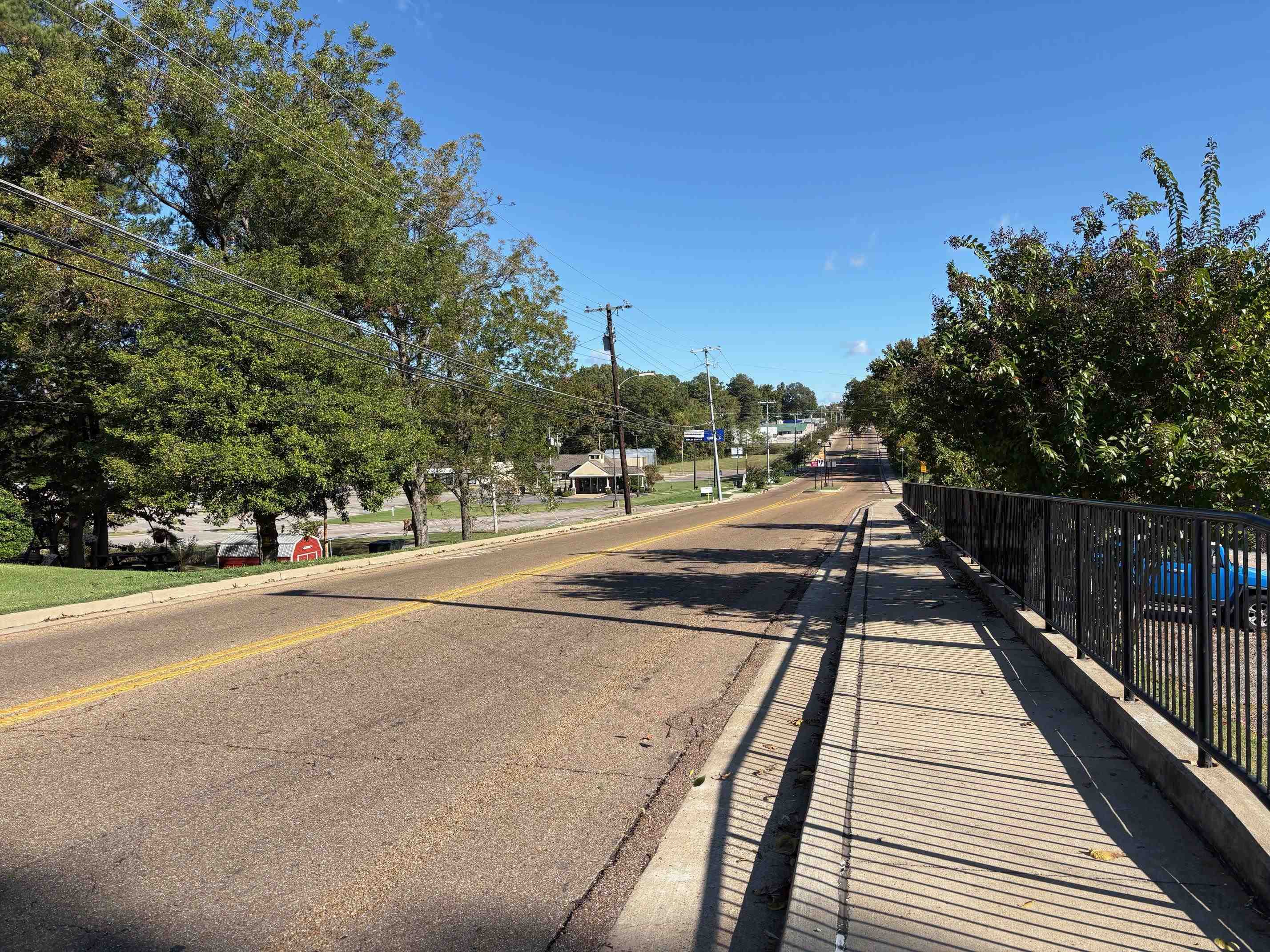 334 Washington Street Ripley, TN 38063 - Photo 7 of 12 a view of a balcony with floor to ceiling windows and wooden fence