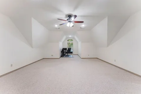 a spacious bathroom with a double vanity sink tub and a mirror