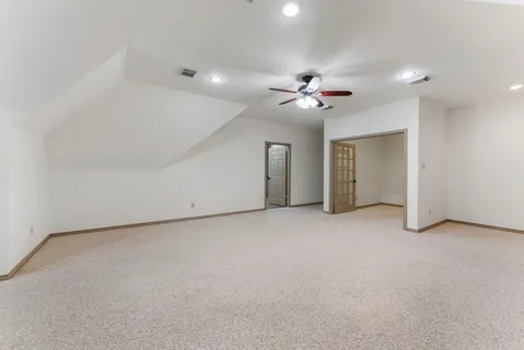 a bedroom with furniture and a chandelier