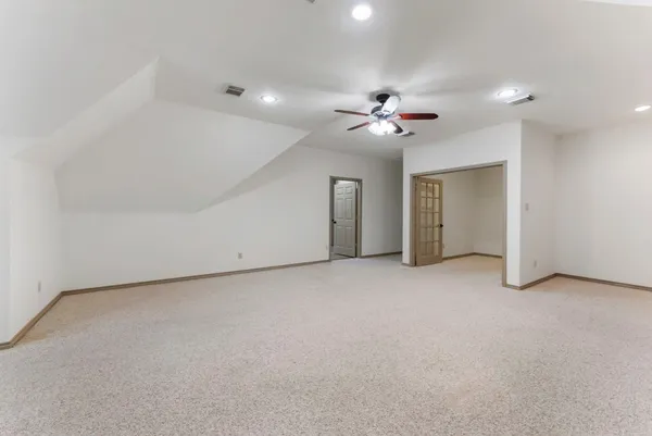 a bedroom with furniture and a chandelier