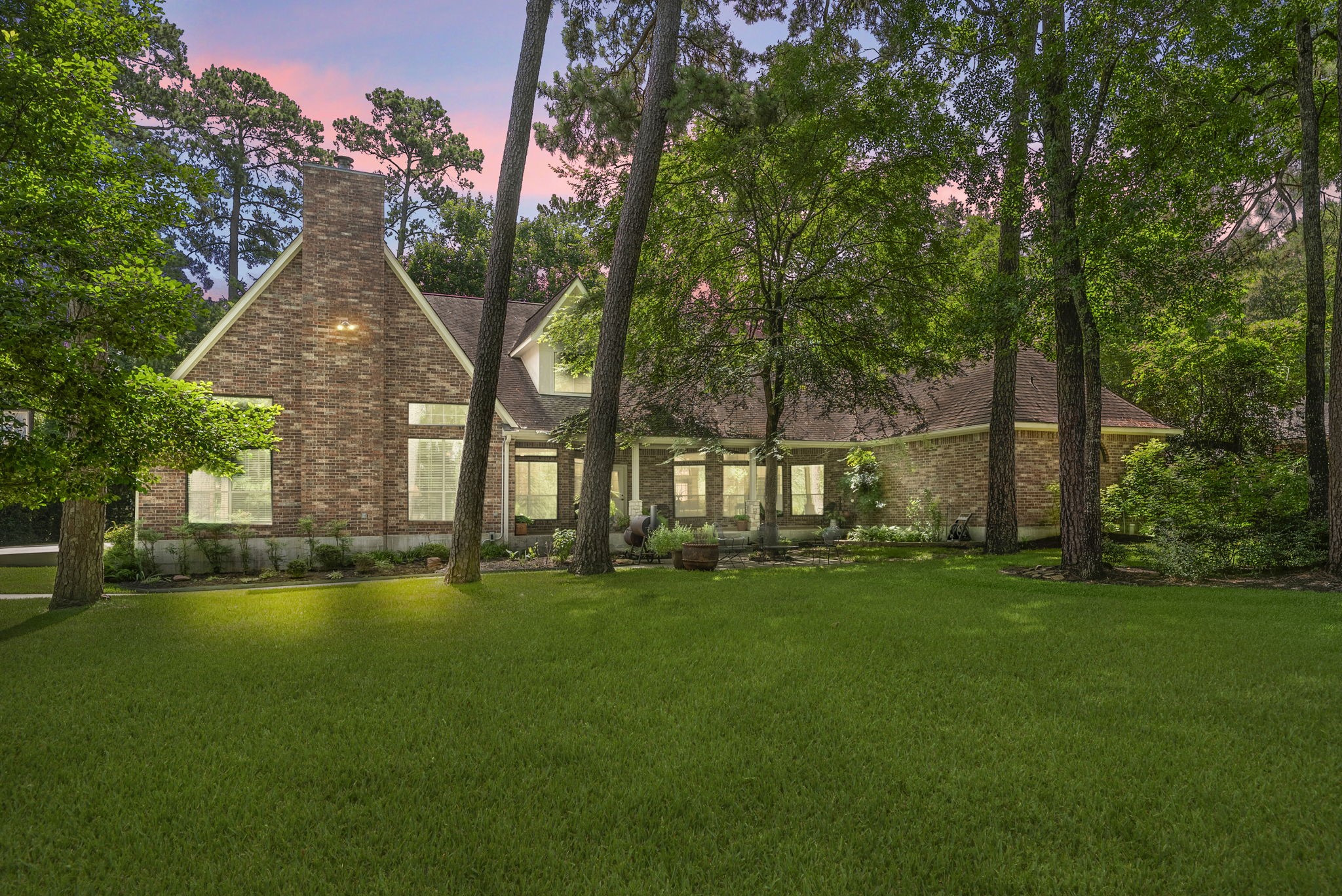 24311 Standing Oak Drive Spring, TX 77389 - Photo 41 of 41 a backyard of a house with table and chairs