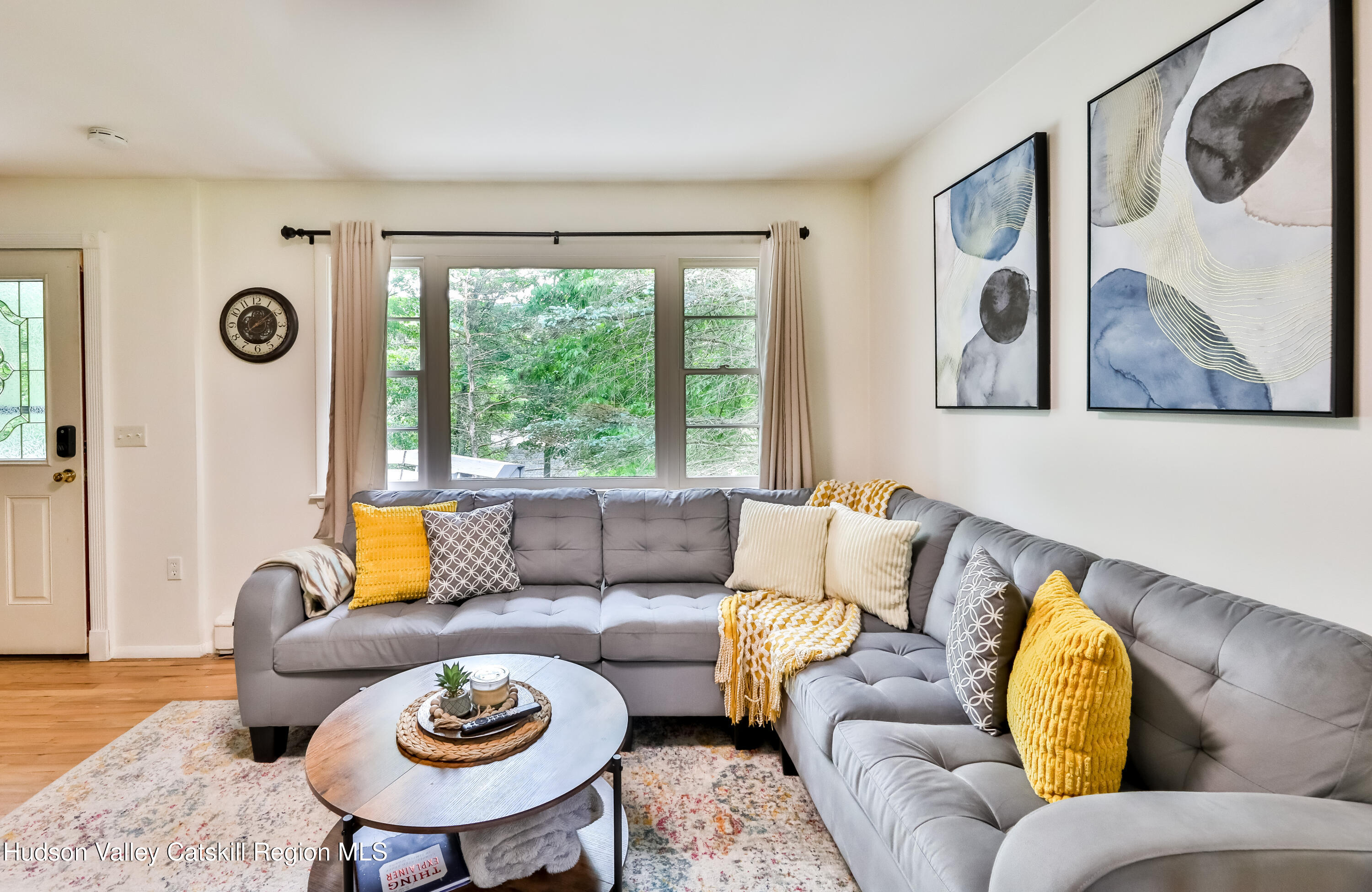 89 Maple Avenue Hunter, NY 12442 - Photo 12 of 41 a living room with furniture and a large window