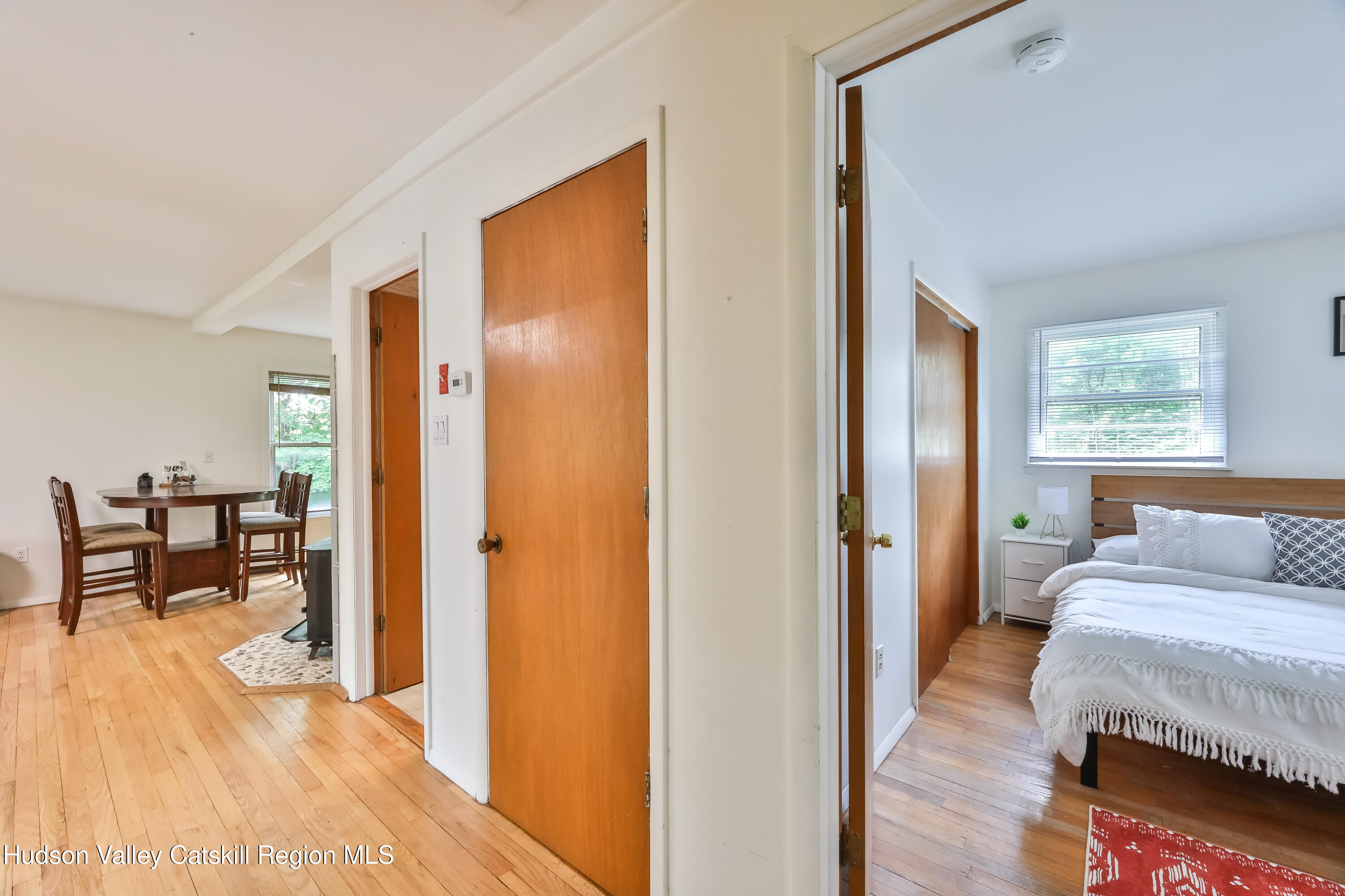 89 Maple Avenue Hunter, NY 12442 - Photo 17 of 41 a view of a bedroom with furniture and window