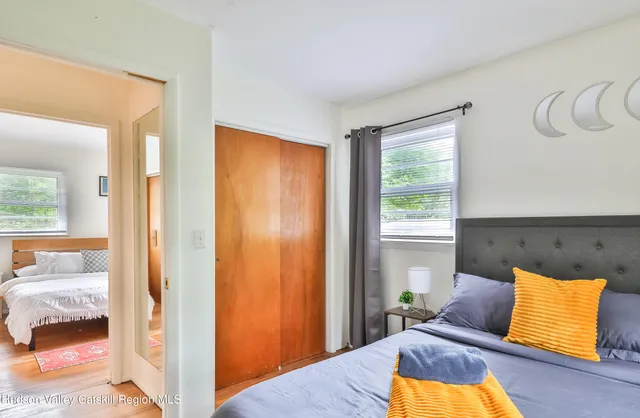 a bedroom with a bed and a window