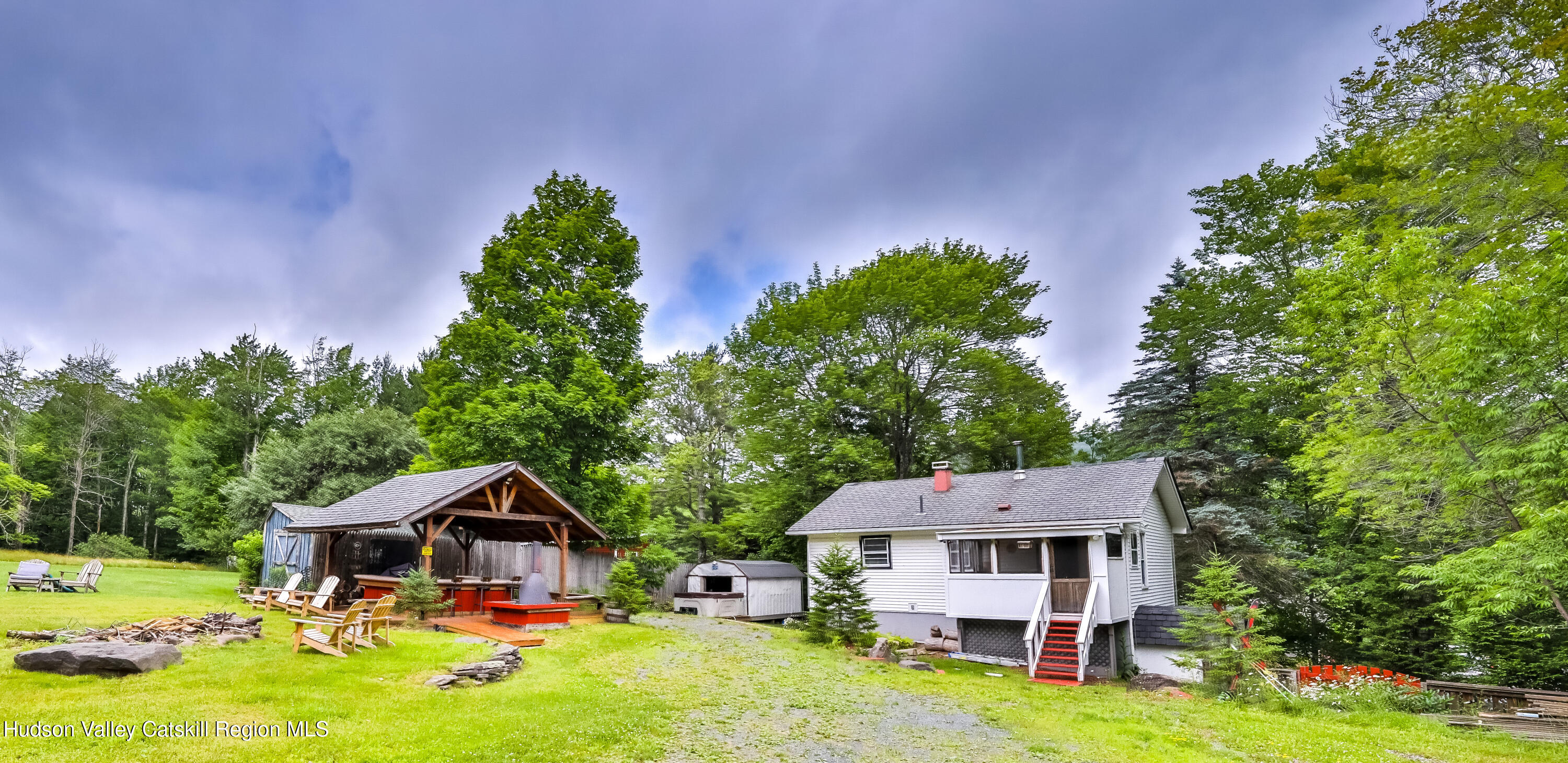 89 Maple Avenue Hunter, NY 12442 - Photo 2 of 41 a front view of a house with garden