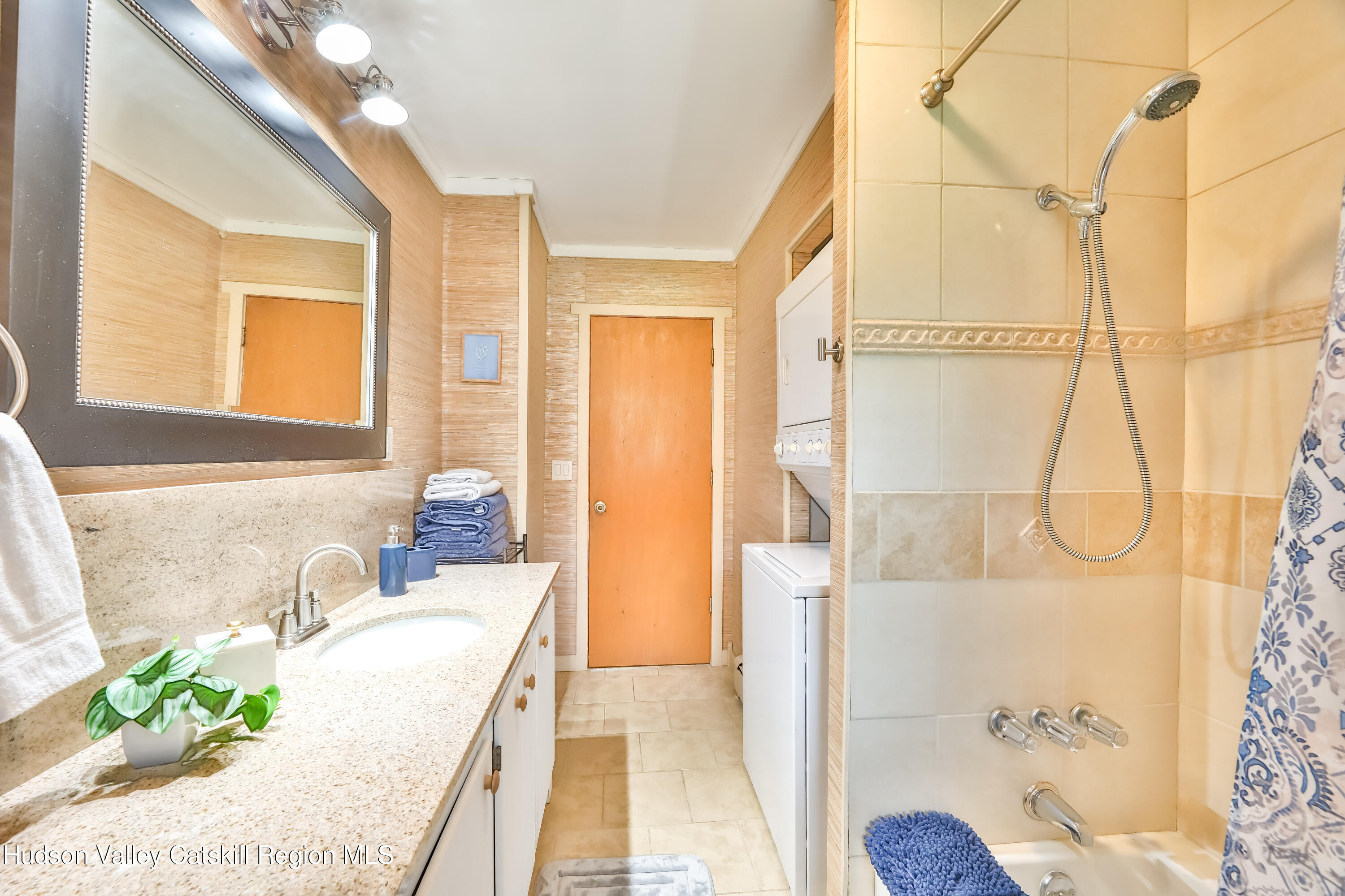 89 Maple Avenue Hunter, NY 12442 - Photo 21 of 41 a spacious bathroom with a granite countertop tub sink and mirror