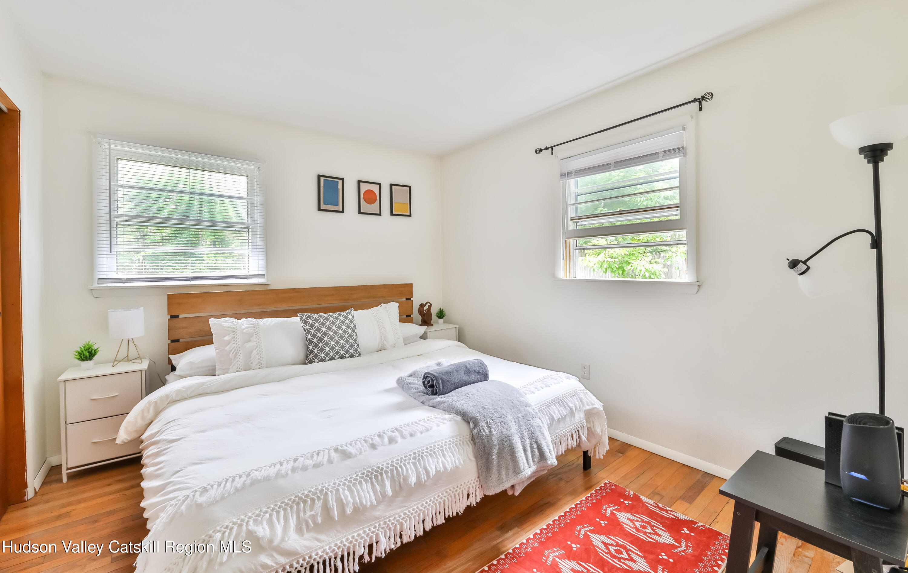 89 Maple Avenue Hunter, NY 12442 - Photo 23 of 41 a bedroom with bed and a window