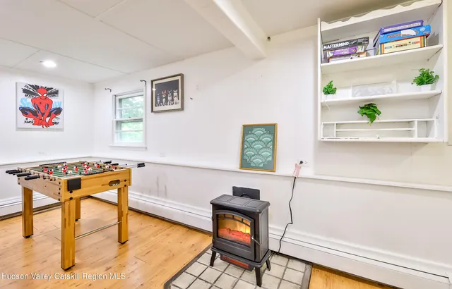 a reading room with furniture and rug