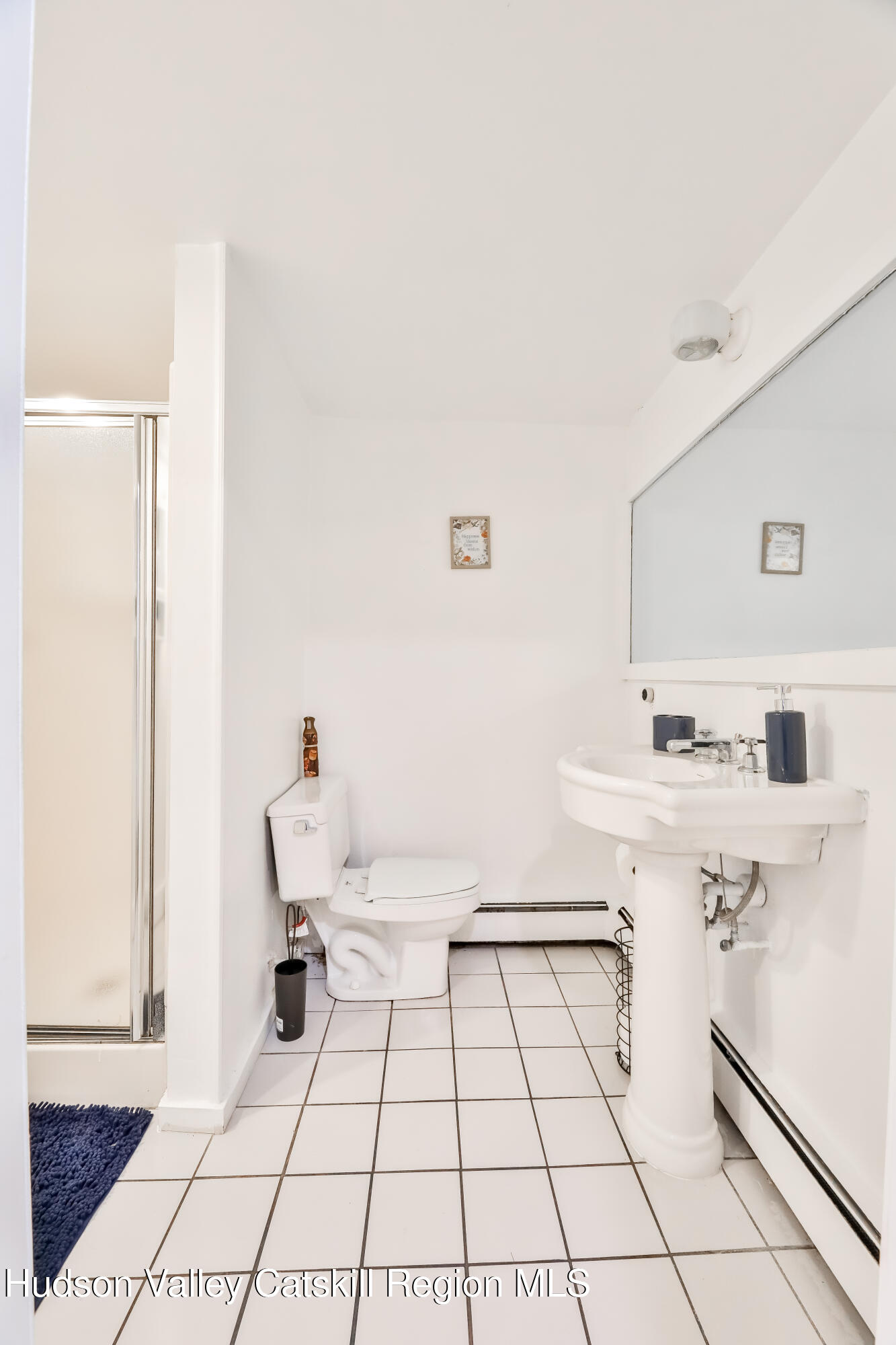 89 Maple Avenue Hunter, NY 12442 - Photo 31 of 41 a bathroom with a sink toilet and mirror