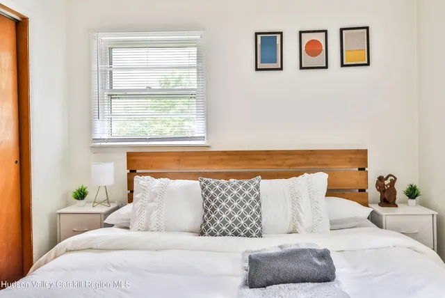 a living room with a couch and painting on the wall