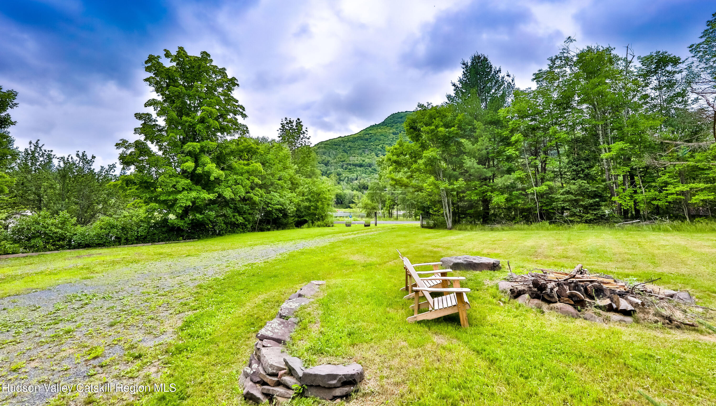 89 Maple Avenue Hunter, NY 12442 - Photo 38 of 41 a view of a lake with lawn chairs