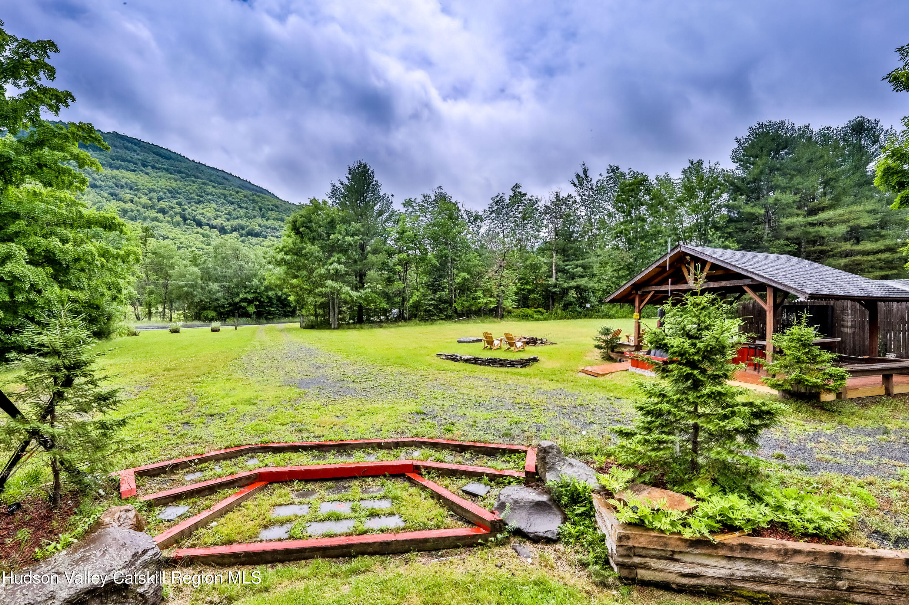 89 Maple Avenue Hunter, NY 12442 - Photo 41 of 41 a view of a swimming pool with a yard and plants