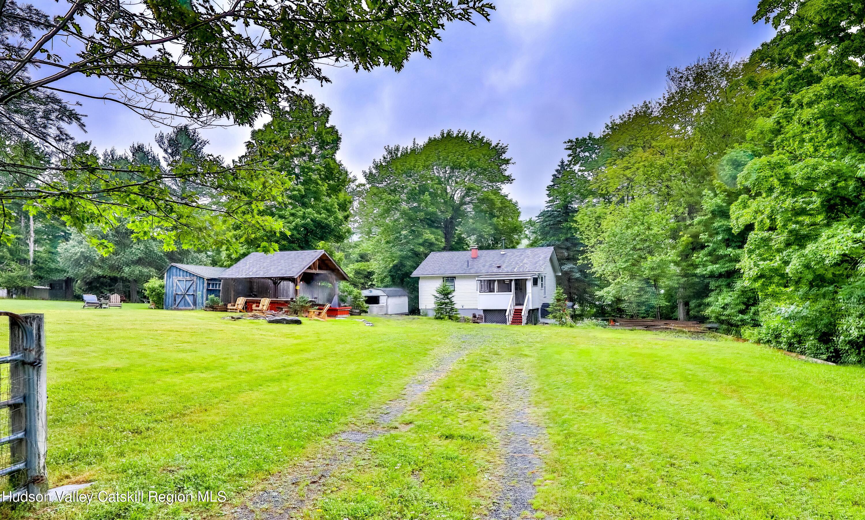 89 Maple Avenue Hunter, NY 12442 - Photo 6 of 41 a house view with a sitting space and garden