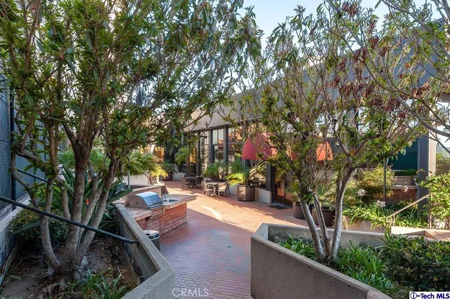 a view of a backyard with sitting area