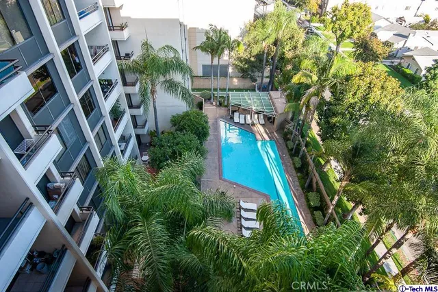 a front view of a building with swimming pool
