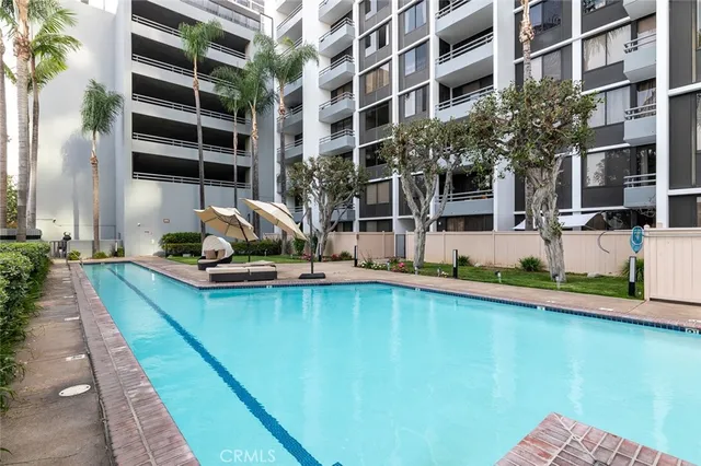 a view of a swimming pool with a patio