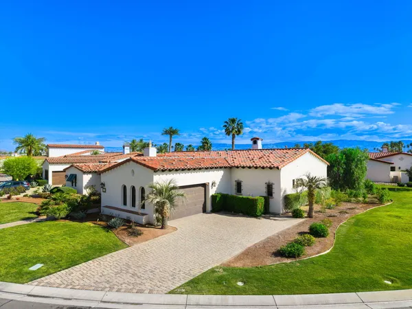 a view of a house with garden and street view