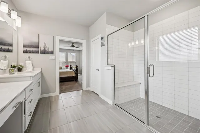a bathroom with a shower and a sink
