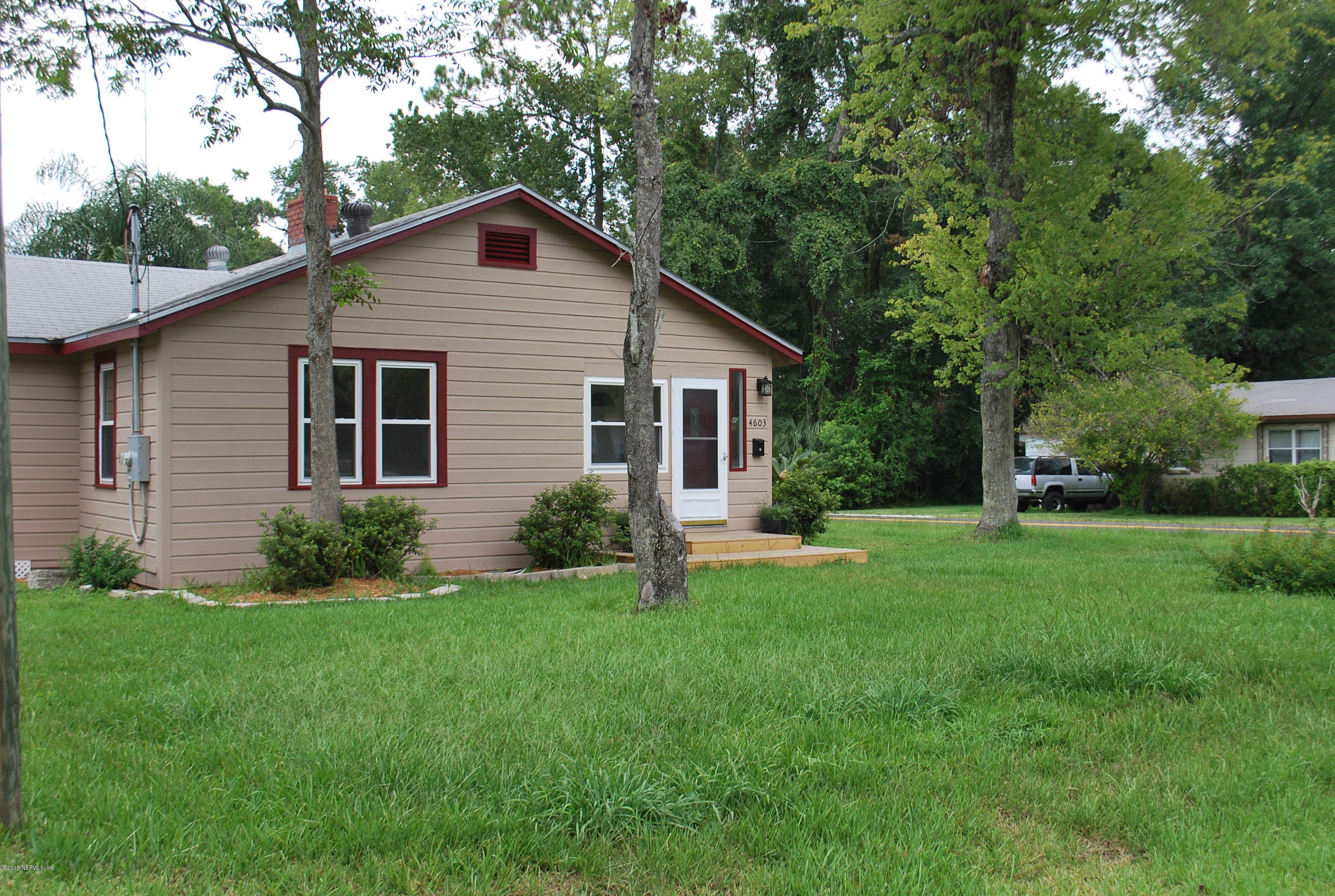 4603 Sunderland Road Jacksonville, FL 32210 - Photo 2 of 20 a front view of house with yard and green space