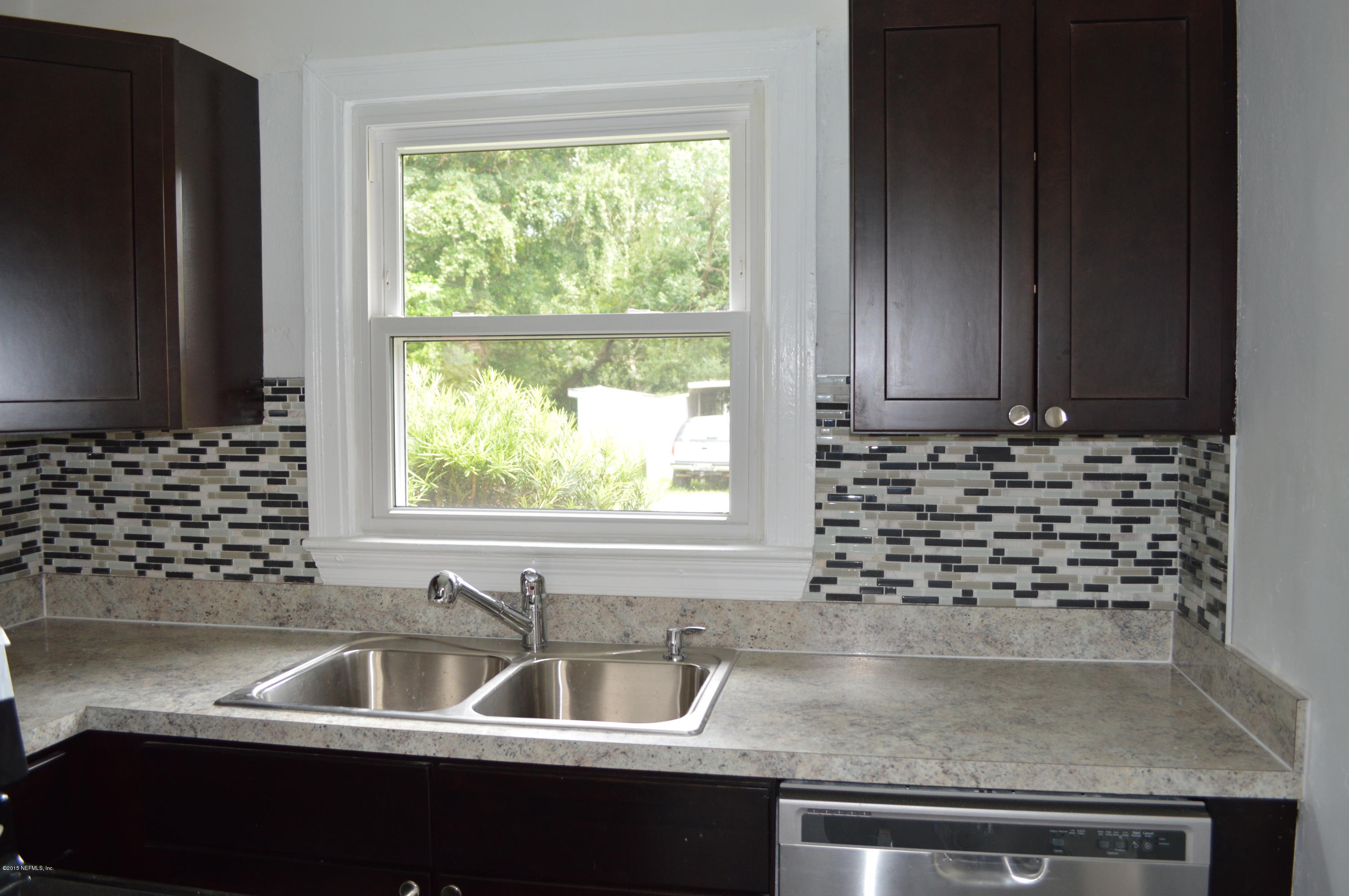 4603 Sunderland Road Jacksonville, FL 32210 - Photo 11 of 20 a kitchen with a sink and a window