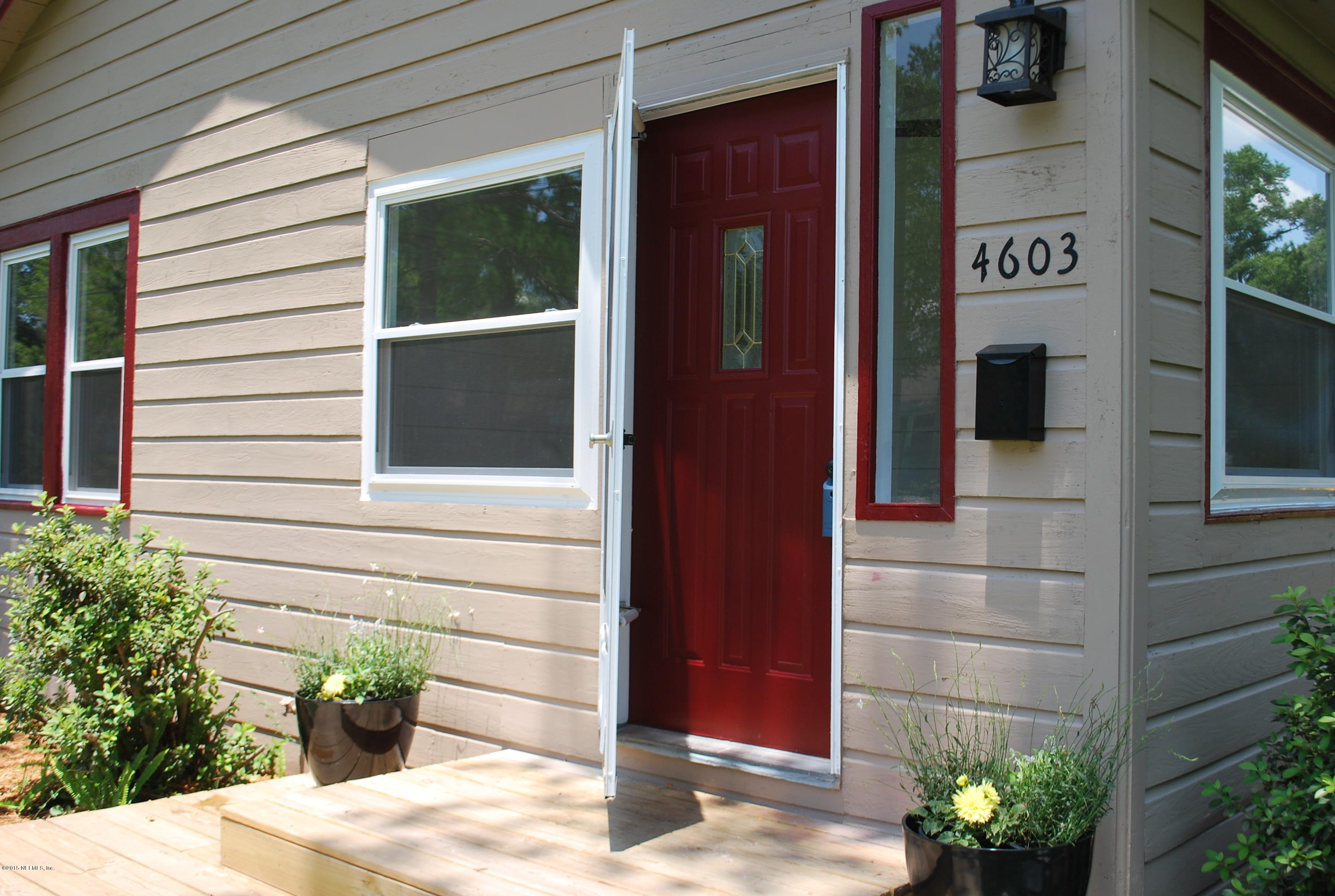 4603 Sunderland Road Jacksonville, FL 32210 - Photo 6 of 20 a potted plant in front of a door