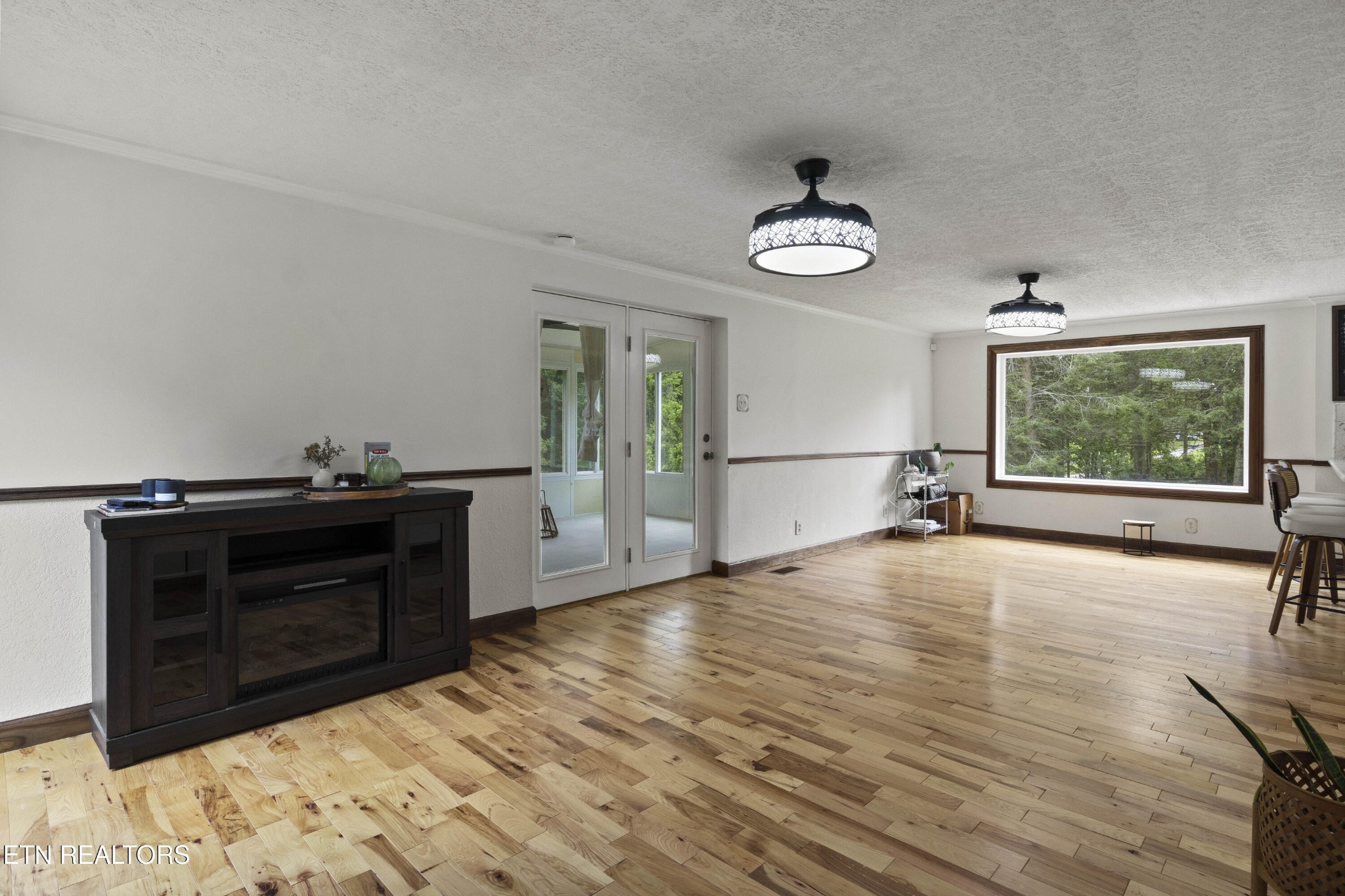 99 Reservoir Road Norris, TN 37828 - Photo 14 of 47 a view of empty room with wooden floor and fan