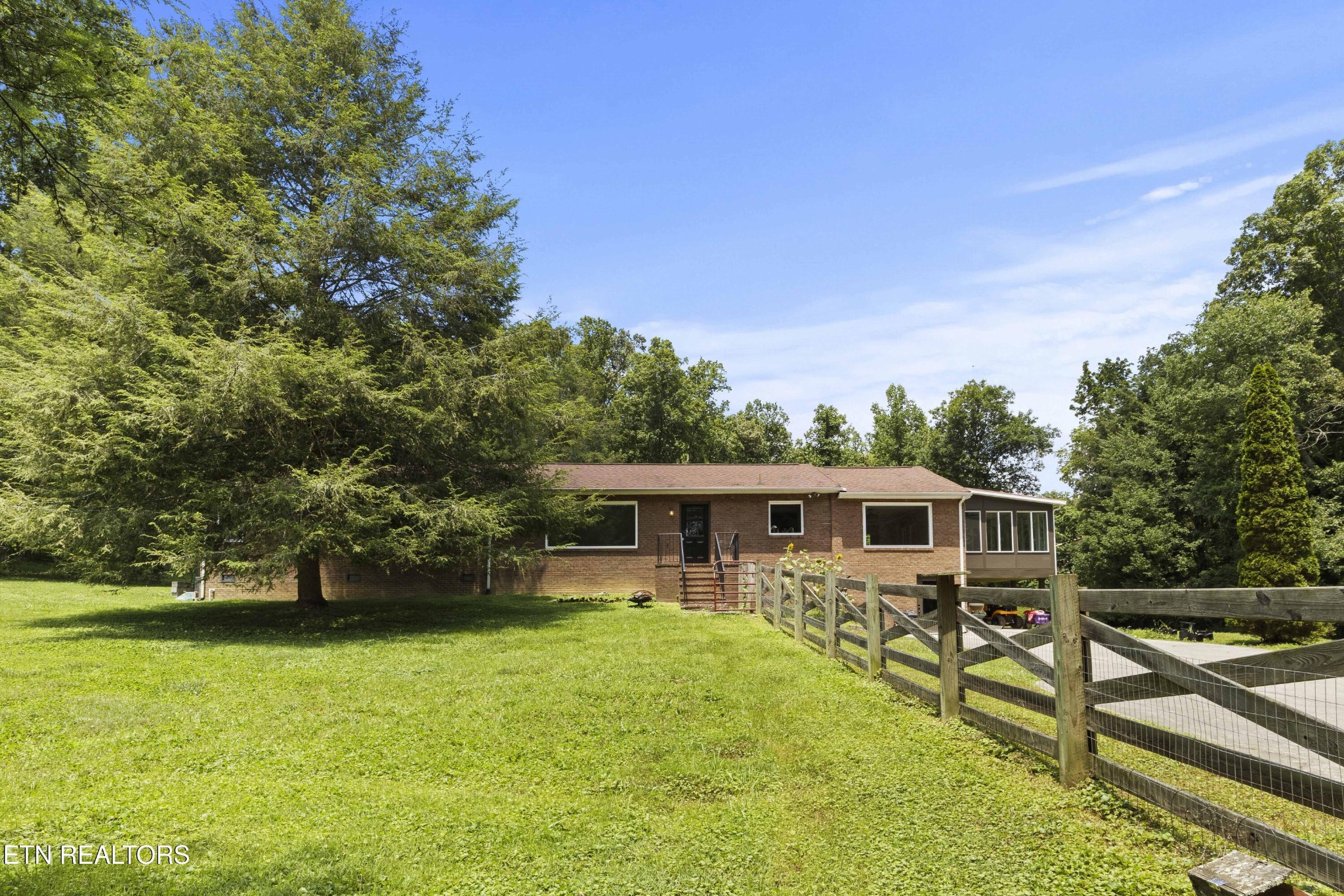 99 Reservoir Road Norris, TN 37828 - Photo 2 of 47 a view of a house with a yard balcony and sitting area
