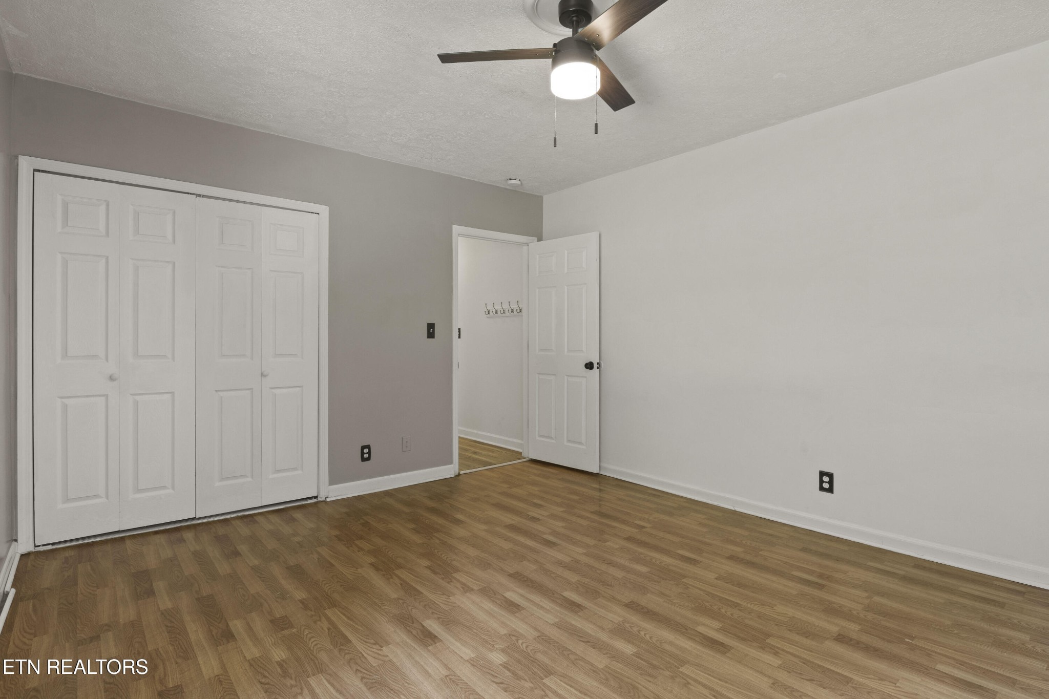 99 Reservoir Road Norris, TN 37828 - Photo 24 of 47 a view of an empty room with wooden floor