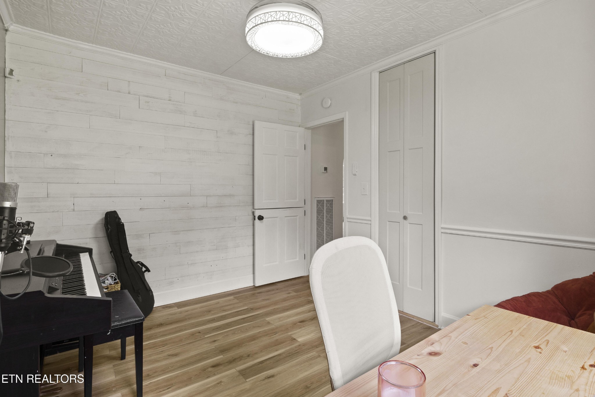 99 Reservoir Road Norris, TN 37828 - Photo 30 of 47 a view of a bedroom with furniture and wooden floor