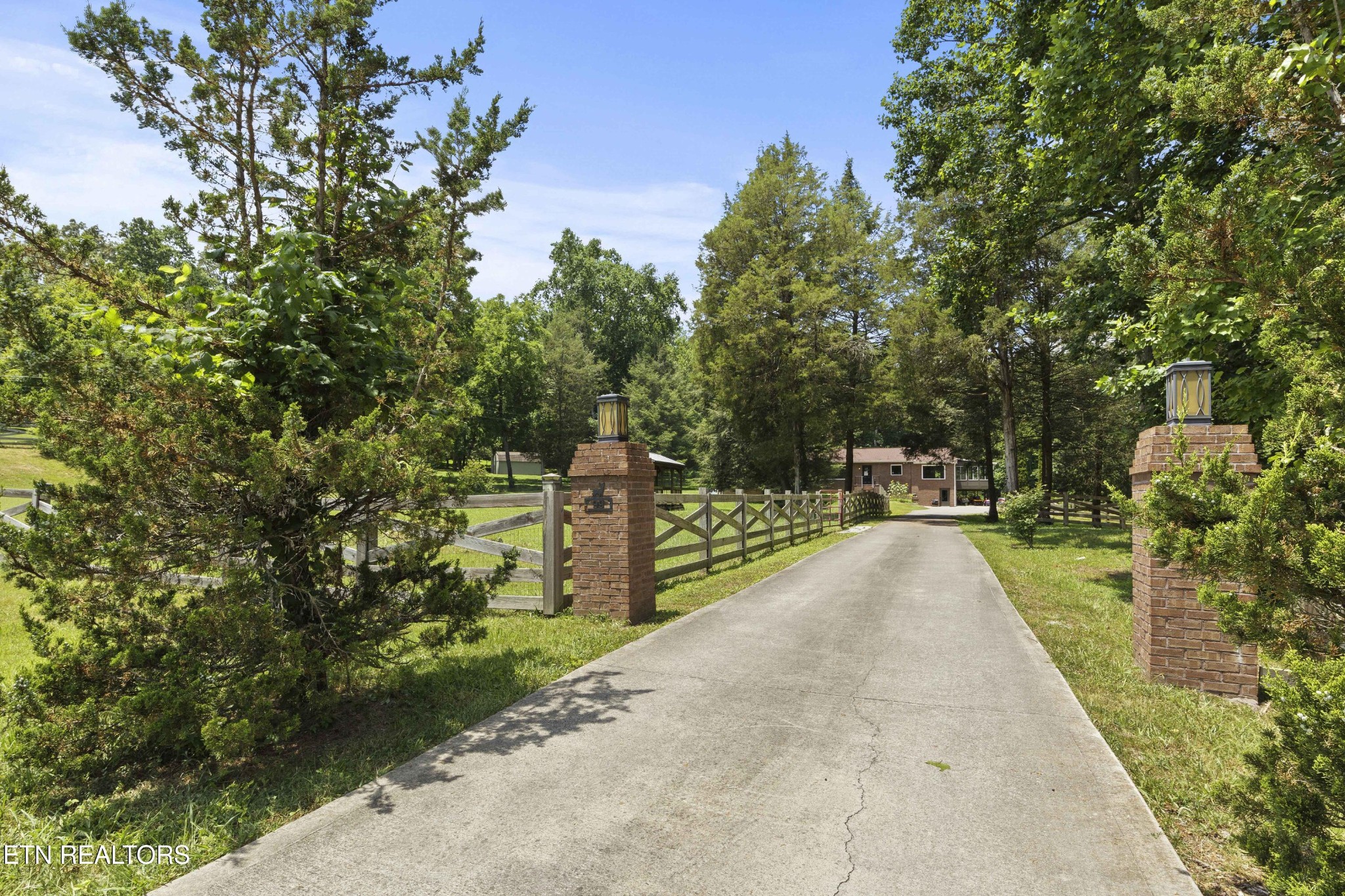 99 Reservoir Road Norris, TN 37828 - Photo 3 of 47 a view of a pathway with a wrought fence
