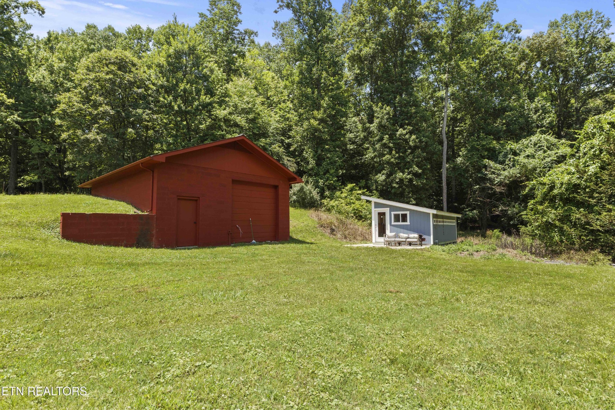 99 Reservoir Road Norris, TN 37828 - Photo 37 of 47 a house with trees in the background