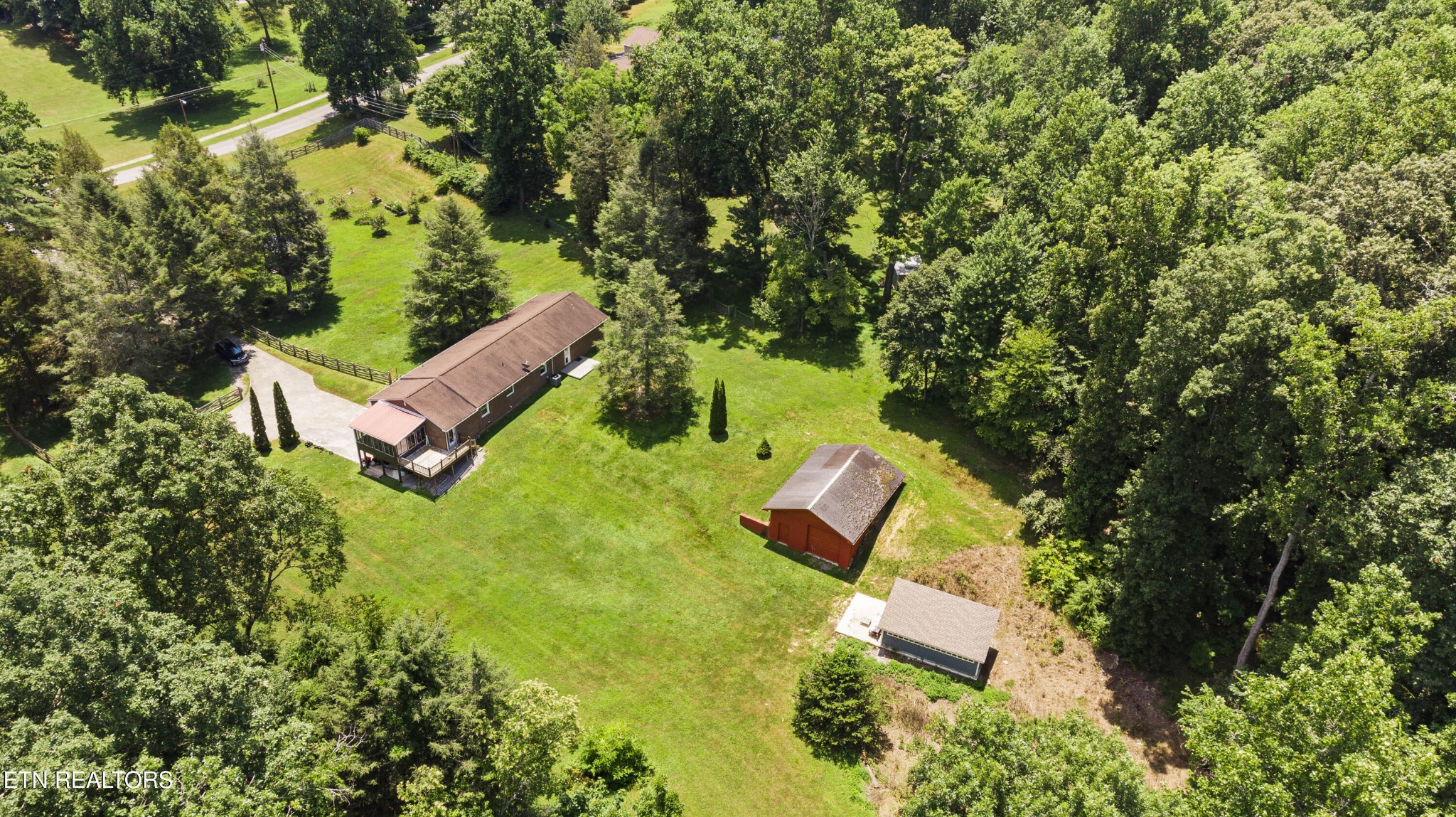 99 Reservoir Road Norris, TN 37828 - Photo 42 of 47 an aerial view of a house with a yard and trees
