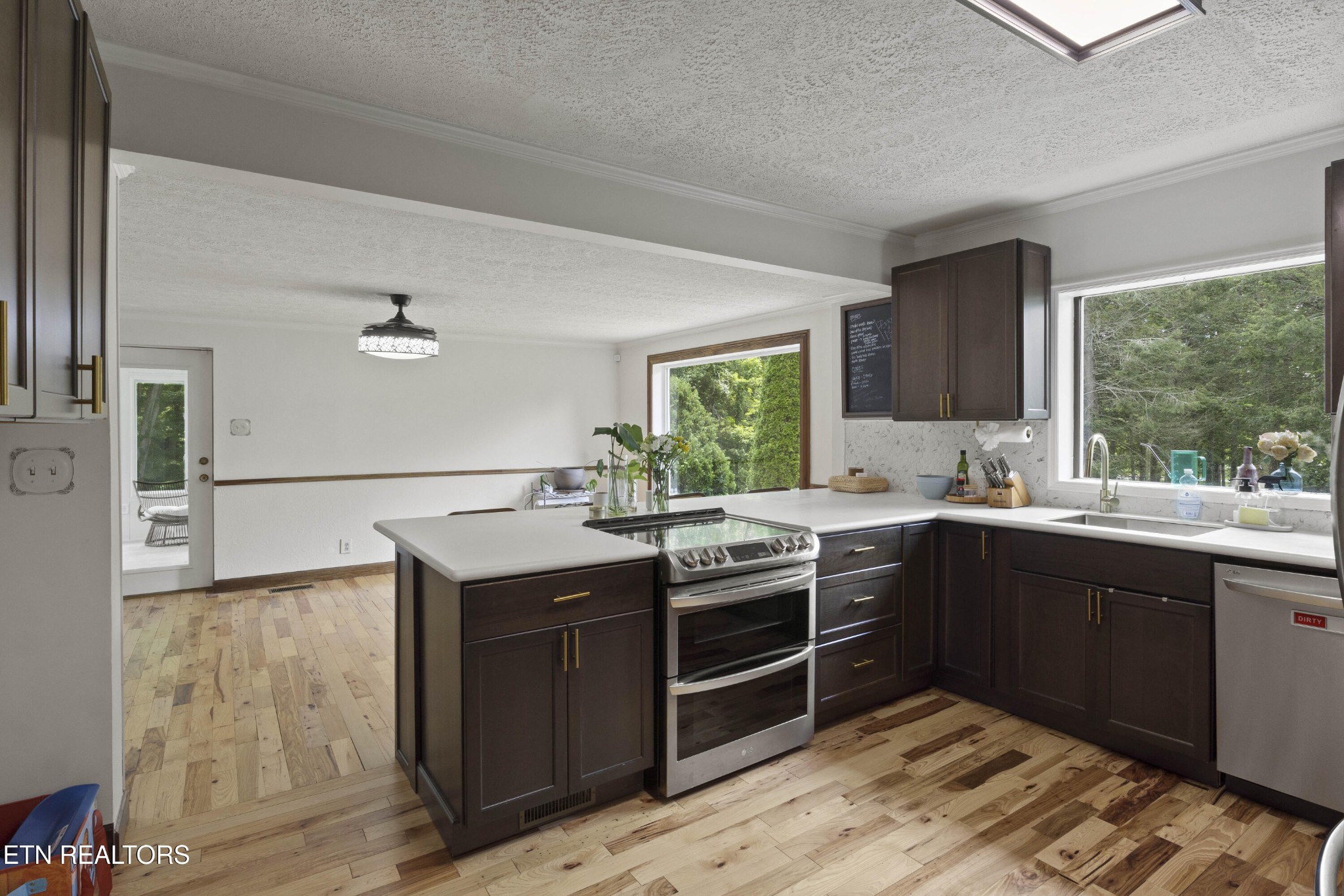 99 Reservoir Road Norris, TN 37828 - Photo 8 of 47 a kitchen with wooden cabinets and sink