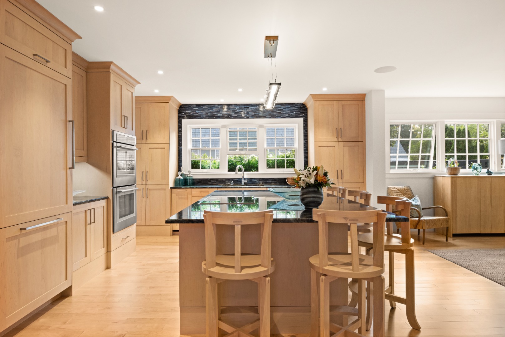 10 Tilton Way Edgartown, MA 02539 - Photo 4 of 37 a kitchen with stainless steel appliances kitchen island granite countertop a table and chairs