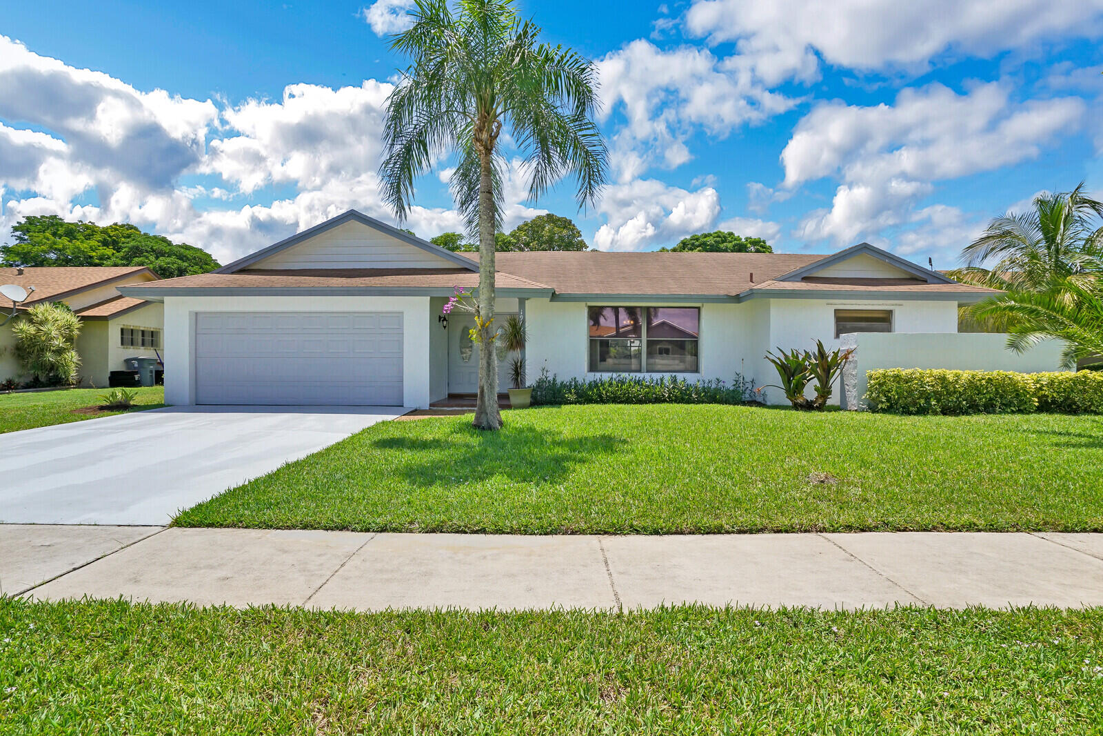 19620 Hampton Drive Boca Raton, FL 33434 - Photo 10 of 45 a front view of house with yard and green space