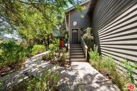 a kitchen with a stove a sink and a refrigerator