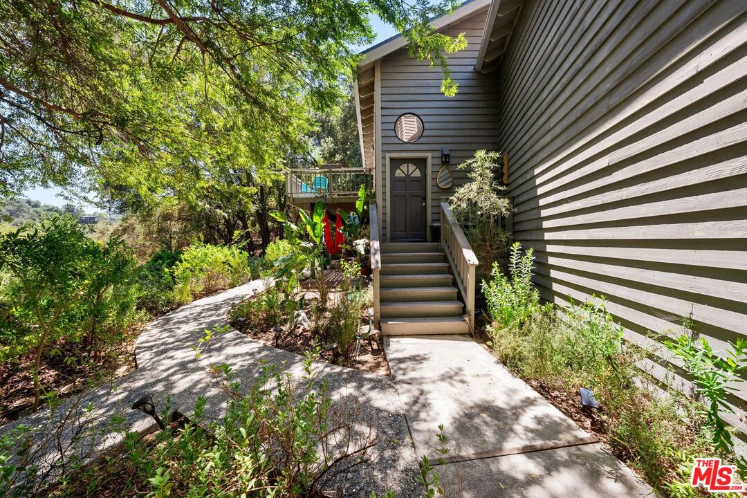 22760 Chamera Lane Topanga, CA 90290 - Photo 11 of 52 a view of a house with a yard