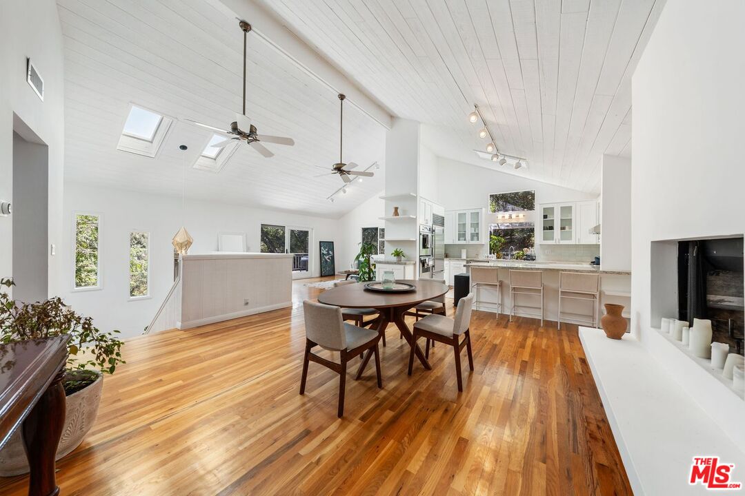 22760 Chamera Lane Topanga, CA 90290 - Photo 19 of 52 a view of a dining room with furniture and wooden floor