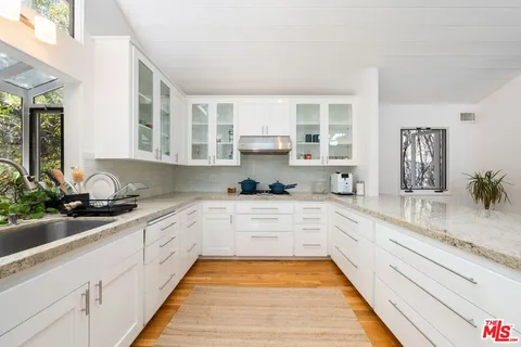 a view of a house with a tree