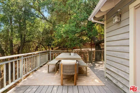 a view of a pathway with a wrought fence
